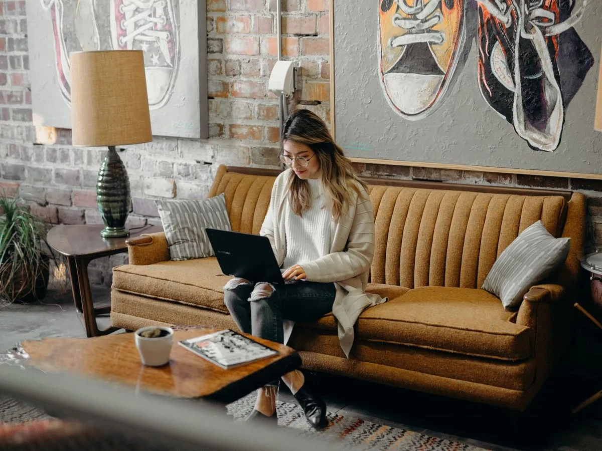 A policyholder managing her coverage from her laptop at home
